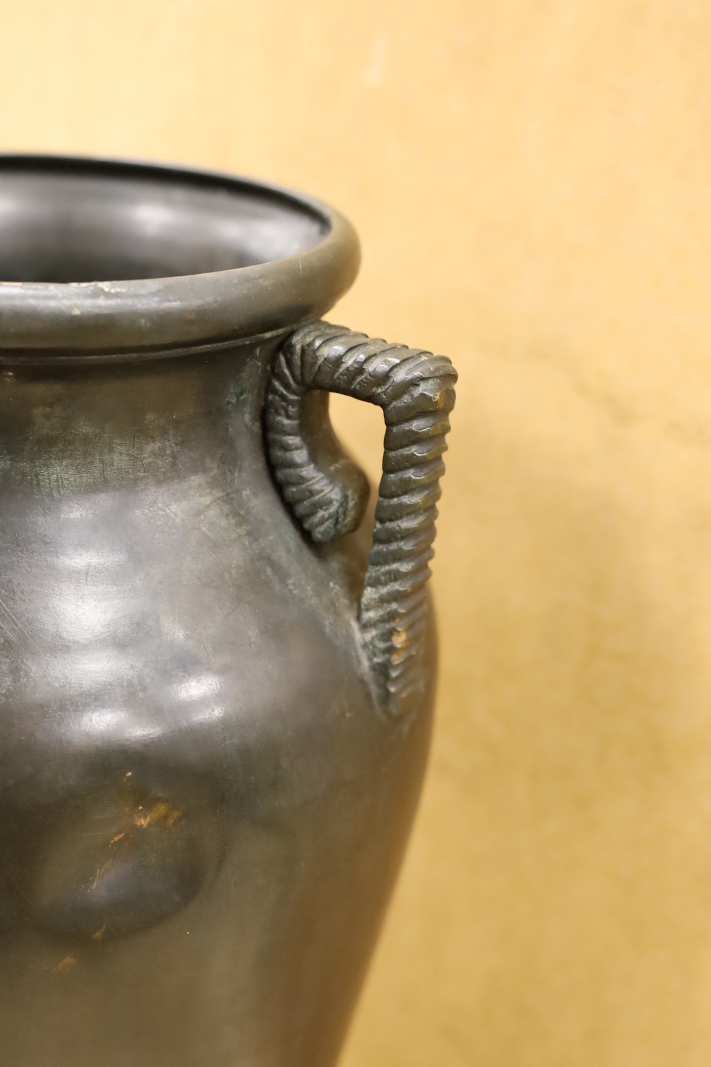 A large Japanese bronze two handled vase, 61cm high